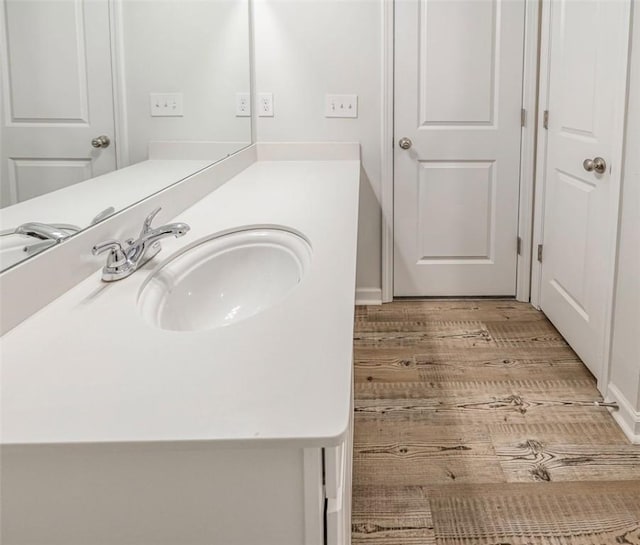 bathroom featuring wood-type flooring and vanity