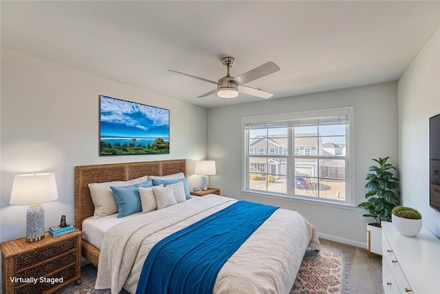 bedroom featuring ceiling fan and carpet flooring