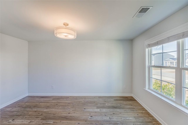 unfurnished room featuring light hardwood / wood-style flooring