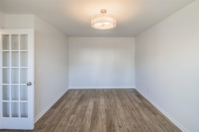 spare room featuring hardwood / wood-style floors