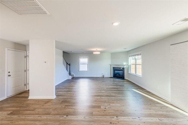 unfurnished living room featuring hardwood / wood-style floors