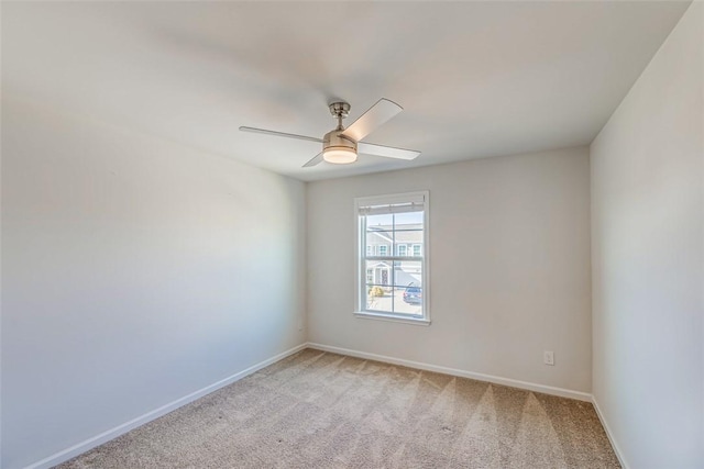 carpeted empty room with ceiling fan