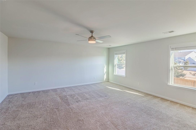 carpeted empty room with ceiling fan