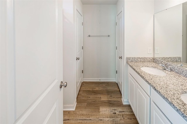 bathroom featuring vanity and hardwood / wood-style floors