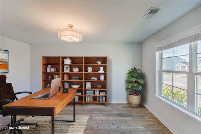 office area with light hardwood / wood-style flooring