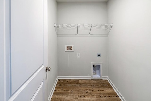 washroom with hookup for a washing machine, hardwood / wood-style floors, and electric dryer hookup