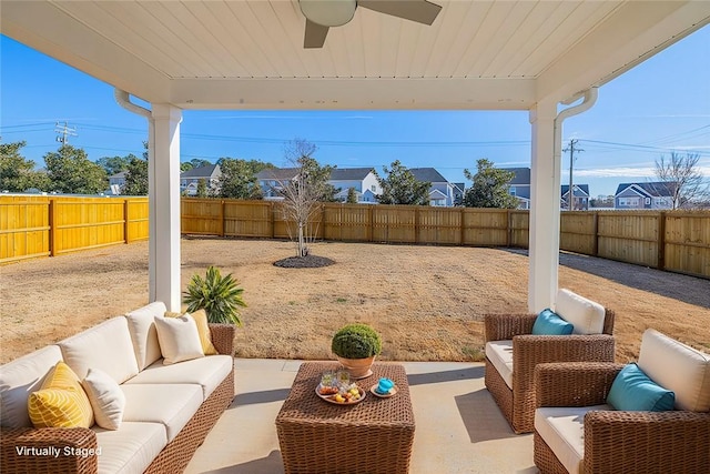 view of patio / terrace with ceiling fan and an outdoor hangout area