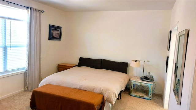 bedroom with light colored carpet