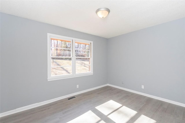 unfurnished room featuring light hardwood / wood-style floors