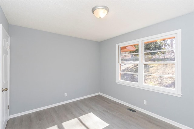 unfurnished room featuring light wood-type flooring