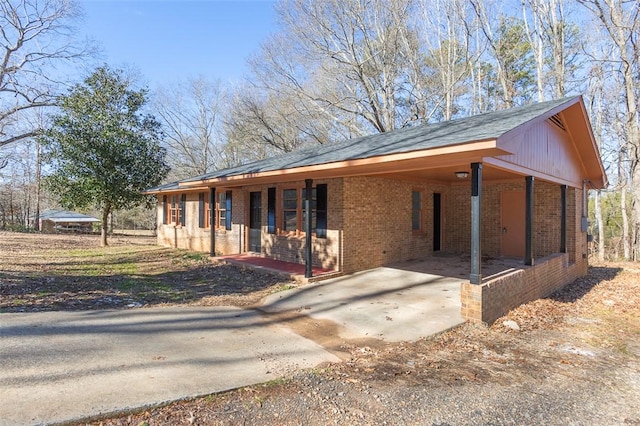 ranch-style house with a carport