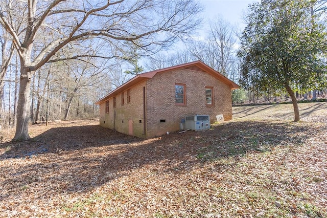 view of property exterior with central AC