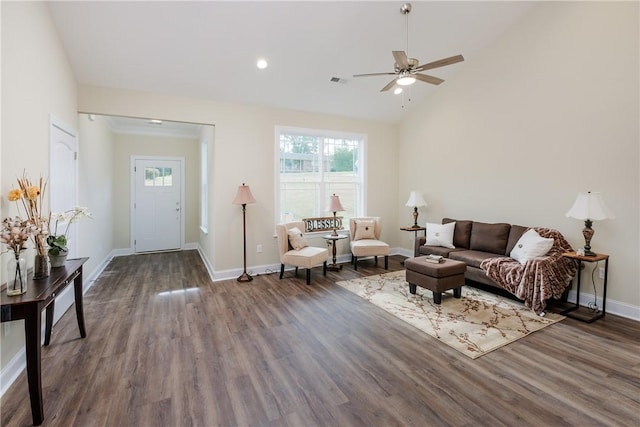 living room featuring dark wood-type flooring, lofted ceiling, and ceiling fan