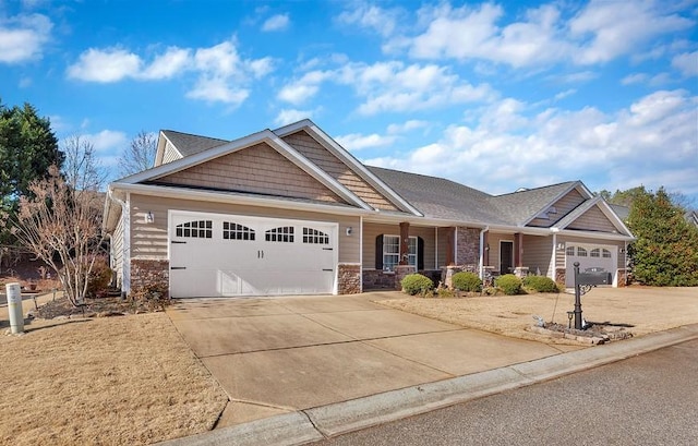 craftsman house with covered porch and a garage