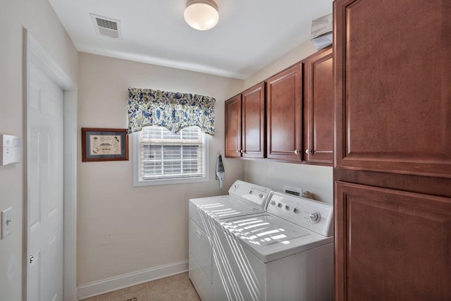 laundry area with cabinets and washer and dryer