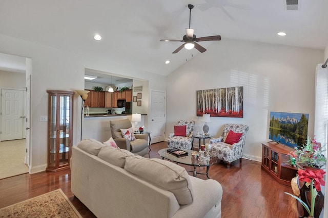 living room featuring ceiling fan, dark hardwood / wood-style floors, and vaulted ceiling