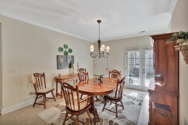 dining area with french doors, an inviting chandelier, and crown molding