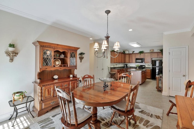 dining area with a chandelier and crown molding