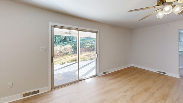 empty room with light hardwood / wood-style flooring