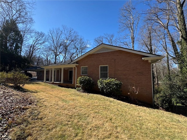 view of home's exterior featuring a yard