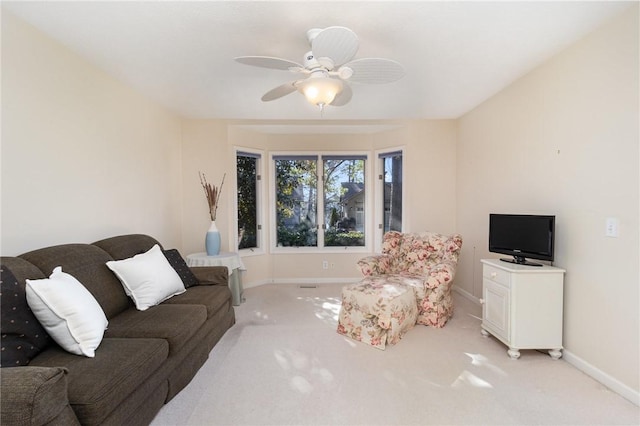 living room featuring ceiling fan and light colored carpet