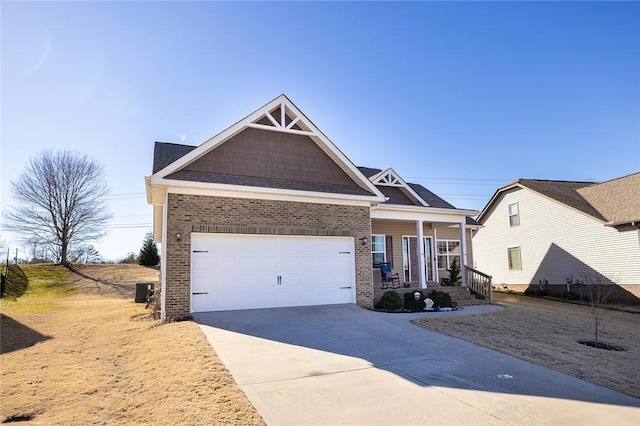 view of front facade with brick siding, covered porch, concrete driveway, and an attached garage