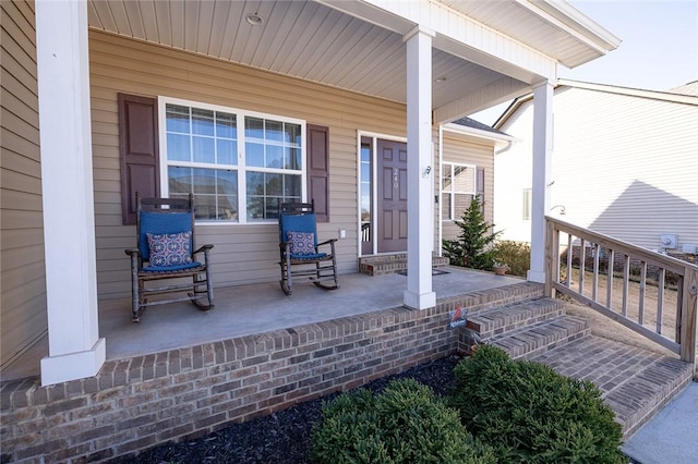 entrance to property featuring a porch