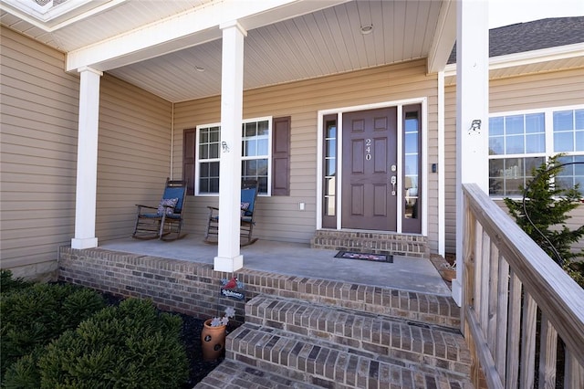 property entrance featuring a porch