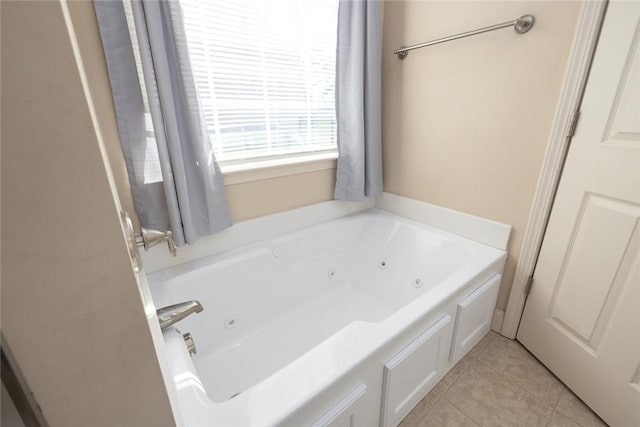 full bath featuring tile patterned flooring and a tub with jets