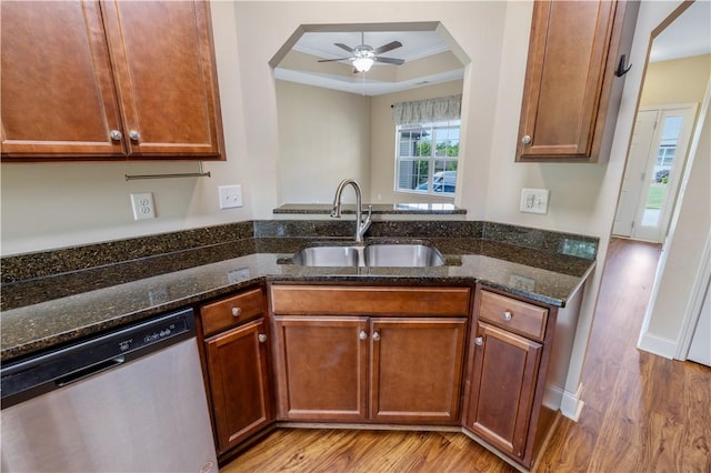 240 Terrace View Way, Seneca, SC 29678 - kitchen featuring stainless steel dishwasher, a sink, a raised ceiling, light wood finished floors, and dark stone counters