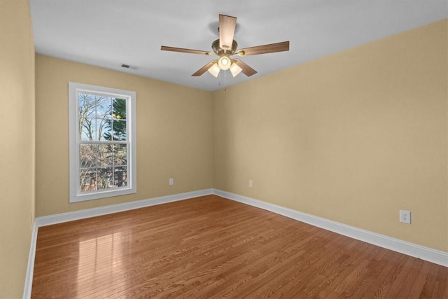 spare room featuring ceiling fan and hardwood / wood-style flooring