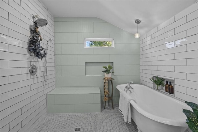 bathroom with independent shower and bath, tile patterned flooring, and lofted ceiling