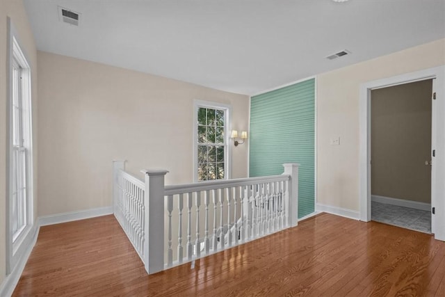 unfurnished bedroom with hardwood / wood-style flooring