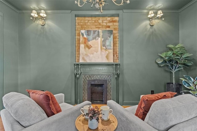 living area featuring crown molding and a tiled fireplace