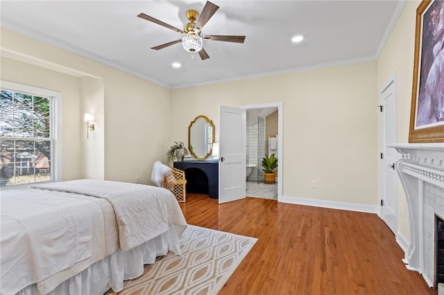 bedroom with crown molding, a fireplace, light wood finished floors, recessed lighting, and baseboards