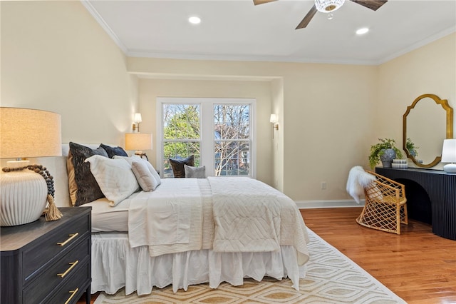 bedroom featuring ornamental molding, recessed lighting, wood finished floors, and baseboards