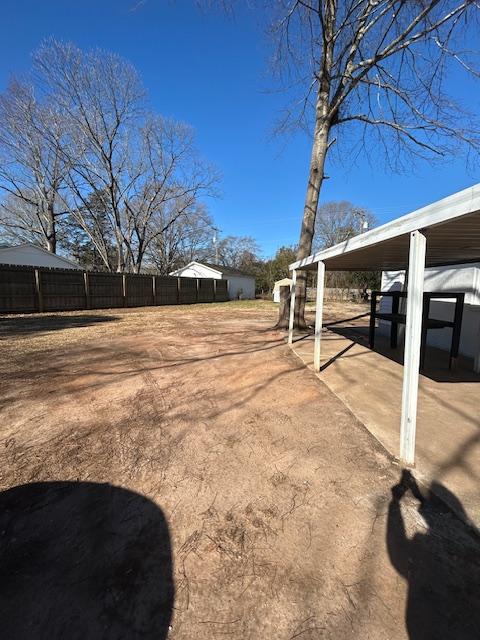 view of yard featuring a carport