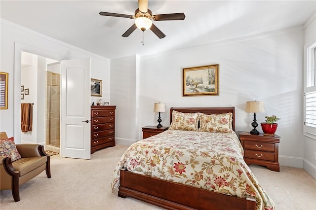 carpeted bedroom with ceiling fan and crown molding