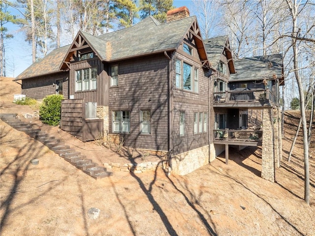 view of side of property featuring a balcony