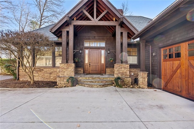 view of exterior entry featuring a garage