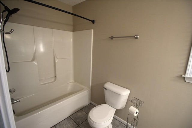 bathroom with toilet, tile patterned floors, and  shower combination