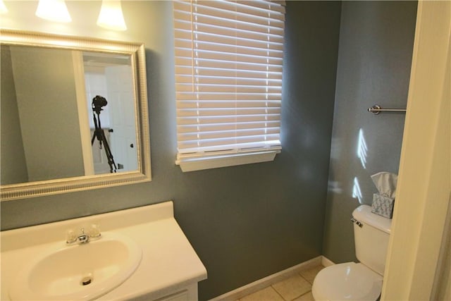 bathroom featuring toilet, tile patterned flooring, and vanity