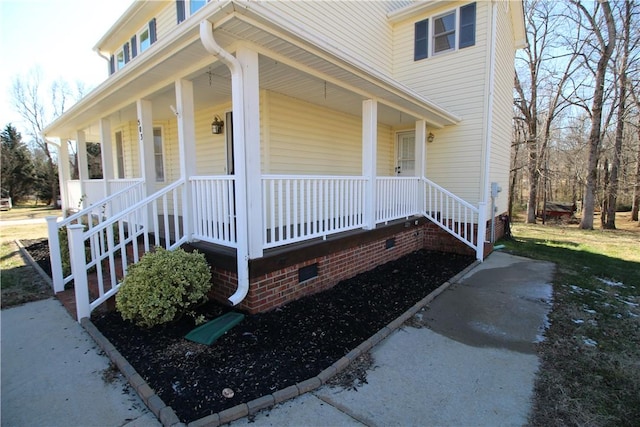 doorway to property featuring covered porch