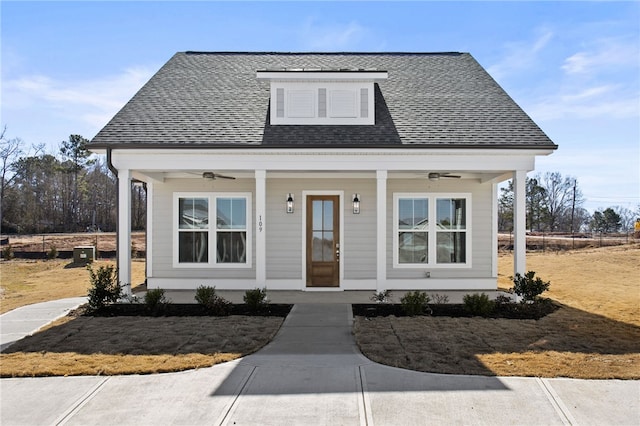 bungalow-style home with a porch, roof with shingles, and ceiling fan