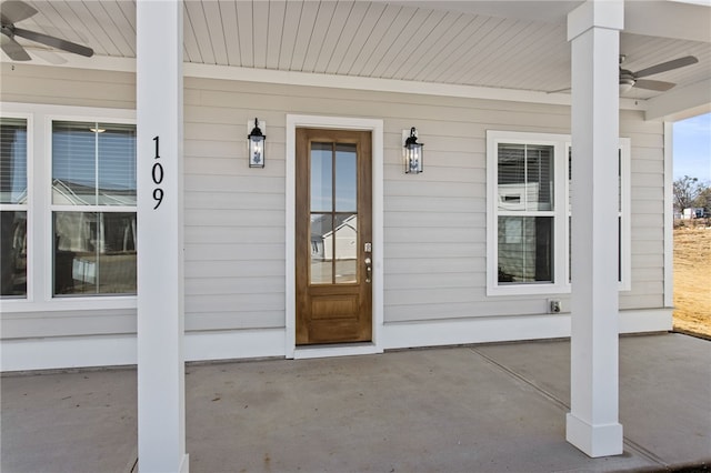 entrance to property featuring a ceiling fan and a porch