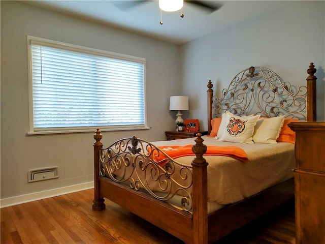 bedroom featuring hardwood / wood-style flooring and ceiling fan