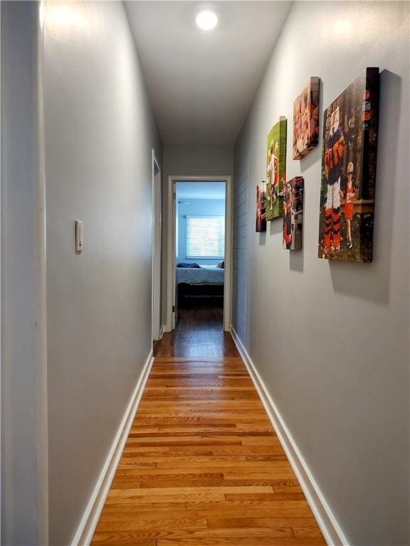 corridor featuring wood-type flooring