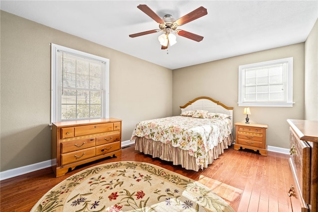 bedroom with ceiling fan and hardwood / wood-style floors