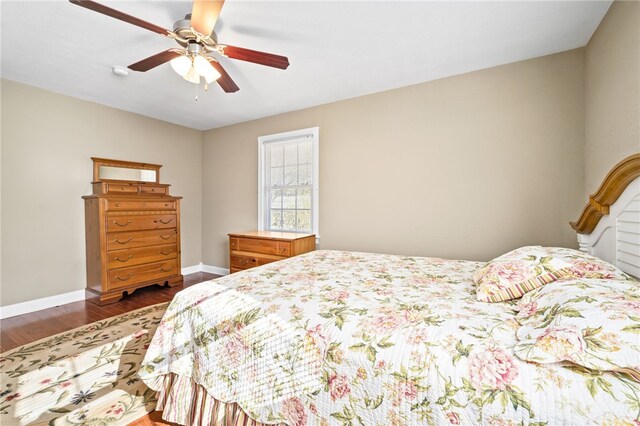 bedroom featuring ceiling fan and dark hardwood / wood-style flooring