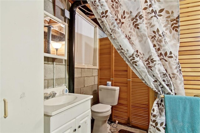 bathroom featuring toilet and vanity